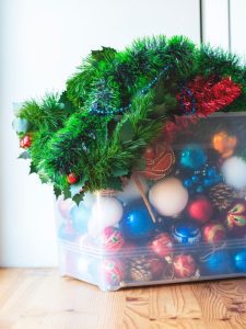 christmas decorations stored in a box for tool shed organization